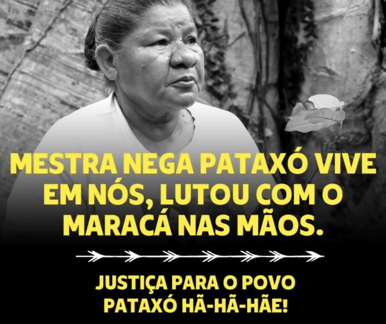 Memorial poster of slain Pataxó leader Maria de Fátima Muniz Pataxó (“Nega”) Memorial poster for the slain Pataxó leader Maria de Fátima Muniz Pataxó (“Nega”) with inscription