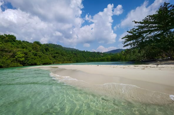 Waves wash over a beach on Koh Kong Island, Cambodia