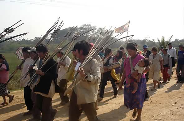 Bolivian Indians walking their protest march with arrow and bow in their hands