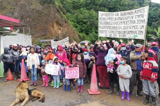 People protesting against mining with banners and posters