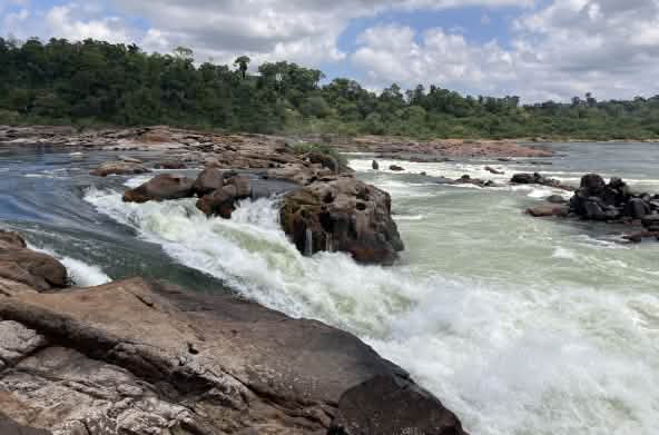The waters of the Xingu River plunge several meters between rocks
