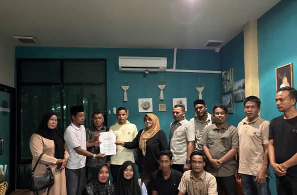 A group of people with a letter