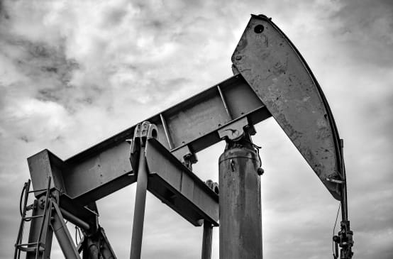 Oil pumpjack with a cloudy sky in the background