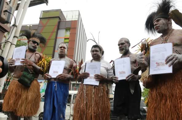 Five Marind with their legal complaint