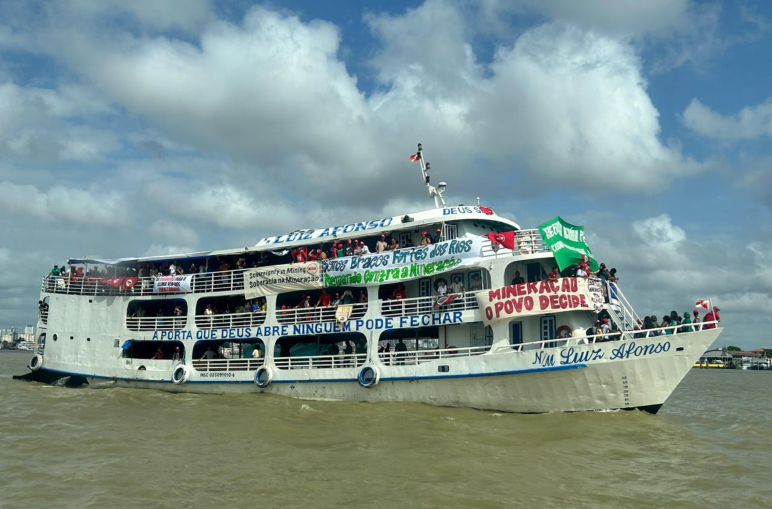A boat with banners on a river