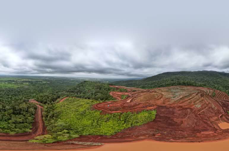 Deforested areas expanding through the rainforest