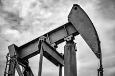 Oil pumpjack with a cloudy sky in the background