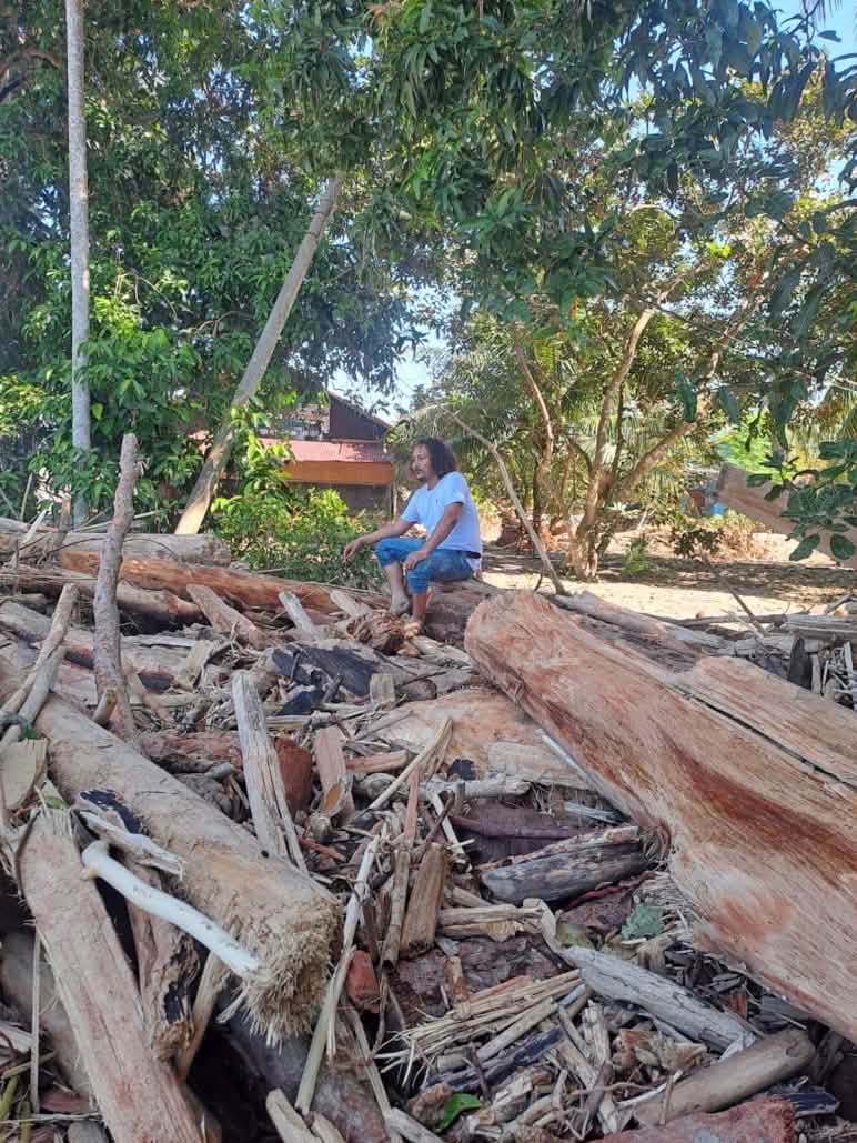 Yusmadi in the ruins of the AWF office after the cyclone of November 2025