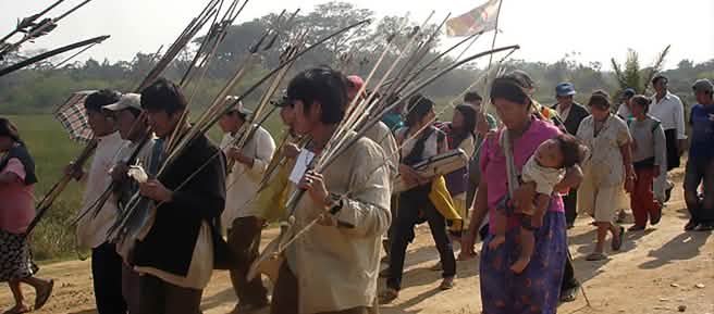 Bolivian Indians walking their protest march with arrow and bow in their hands