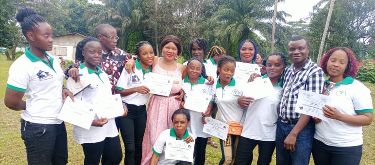 Ten women present their certificates after learning to read, write and do basic math in a WCF project Ten women who learned to read, write and do basic math in a WCF project present their certificates