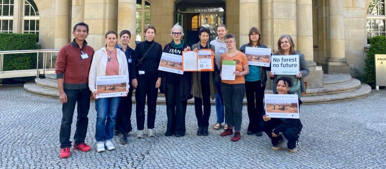 Representatives of Rainforest Rescue, FIAN, Powershift, and Weed after handing over the petition