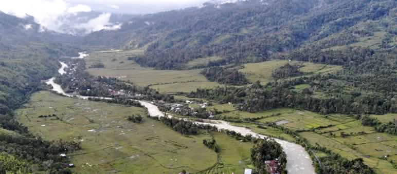Aerial photo of a valley with a river and small villages