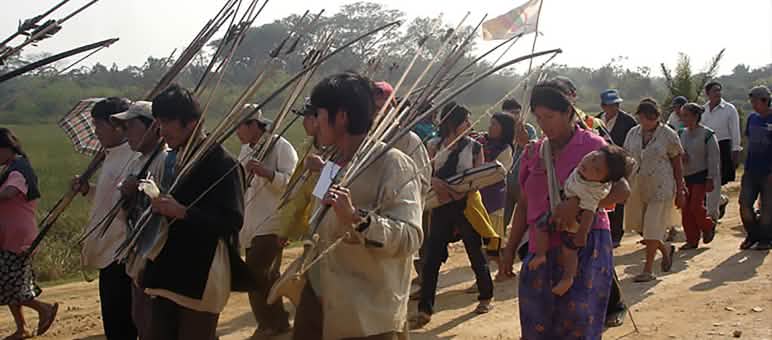 Bolivian Indians walking their protest march with arrow and bow in their hands