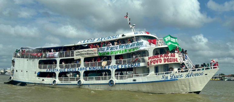 A boat with banners on a river