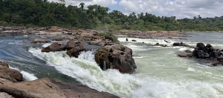 The waters of the Xingu River plunge several meters between rocks