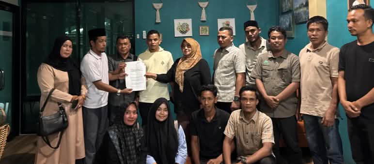 A group of people with a letter