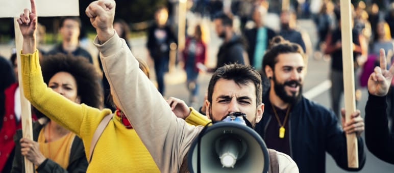 SLAPP suits have one goal: silencing protest. Protest march