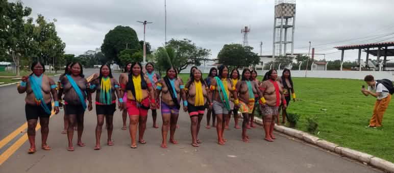 Twenty Indigenous women blocking a road