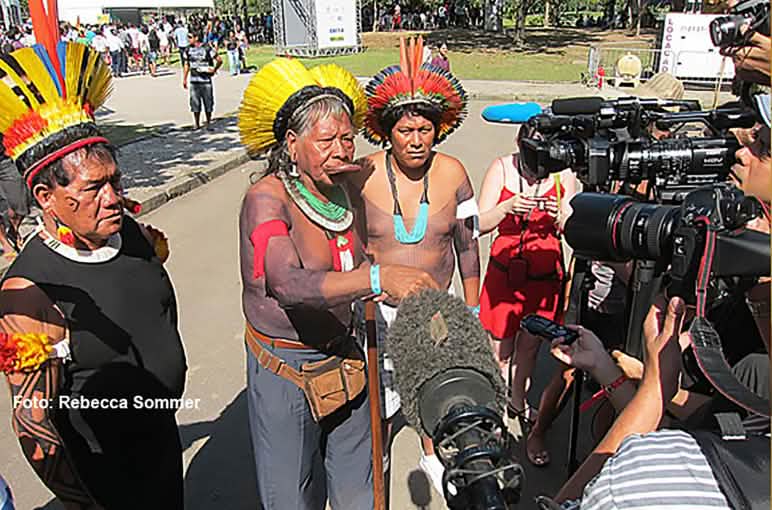 Chief Raoni with his feathered headdress and war paint gives an Interview