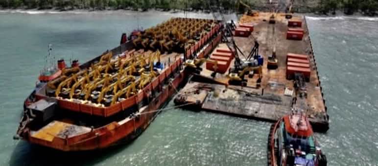 A barge full of excavators