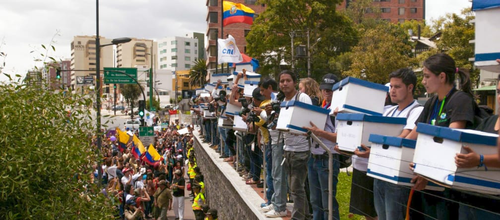 A large group of young people at the National Electoral Commission of Ecuador in Quito in 2014, delivering 757,000 signatures calling for a referendum on Yasuní National Park.