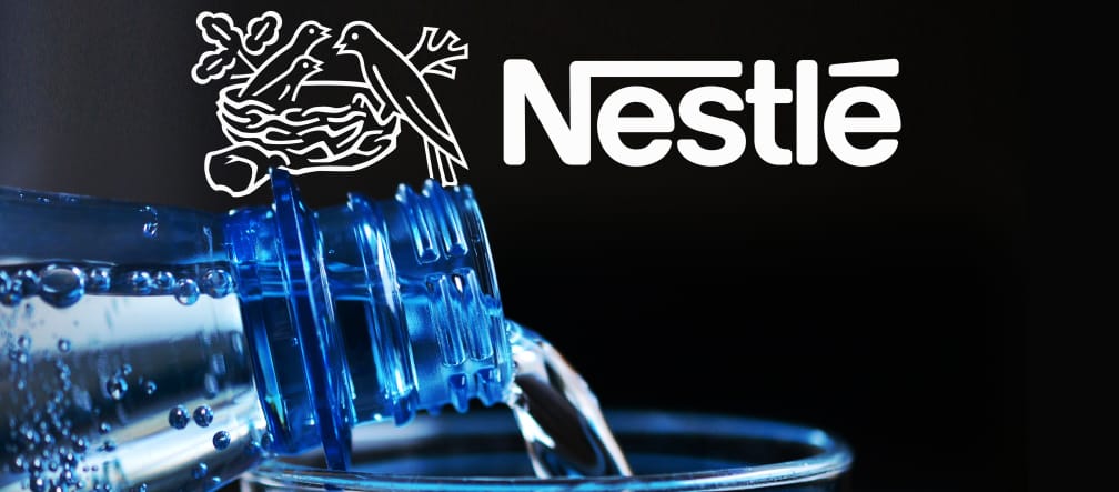 Nestlé is one of the world’s largest sellers of bottled water. Water bottle close-up with Nestlé logo