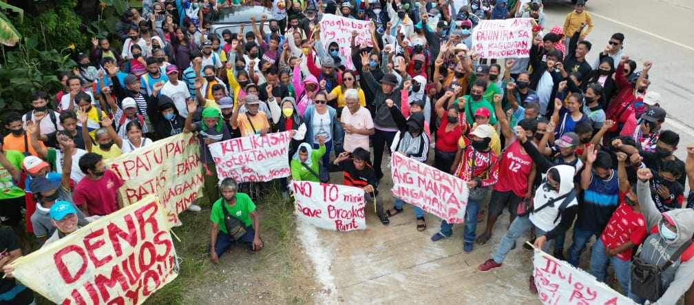 Residents of Brooke’s Point form a human barricade in front of Ipilan Nickel Corporation’s mining site