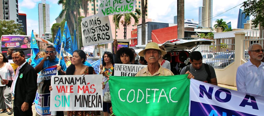 Panama City: people with hand-painted banners protesting against mining