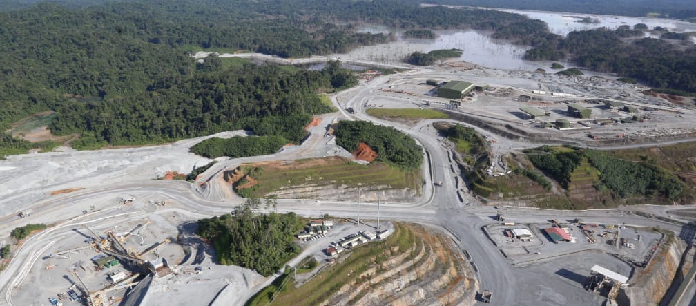 Aerial view of a copper mine cut into the rainforest