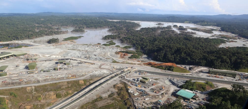 Aerial view of a copper mine cut into the rainforest