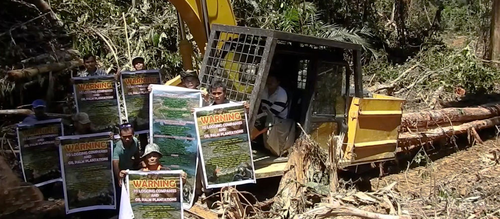 Penan and Berawan people are resisting the destruction of their forest Protest against palm oil plantation in Sarawak