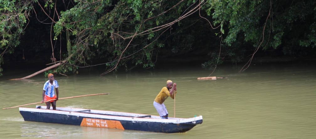Two people canoeing on the river