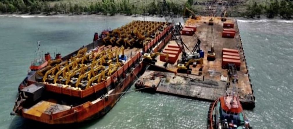 Barge full of excavators