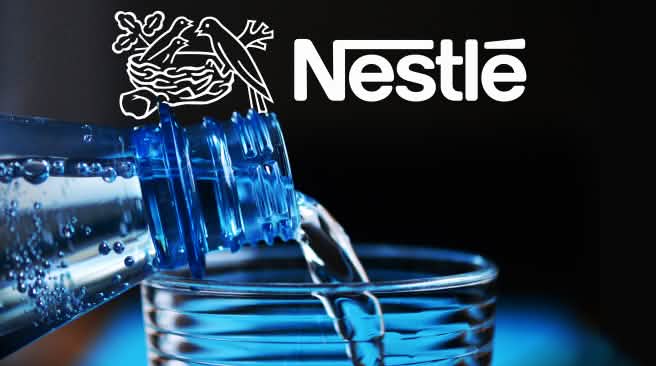 Nestlé is one of the world’s largest sellers of bottled water. Water bottle close-up with Nestlé logo