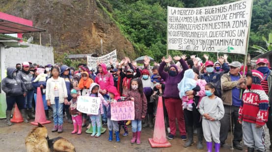 People protesting against mining with banners and posters