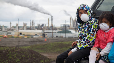 Children with face masks during the 2013 Healing Walk against tar sand mining