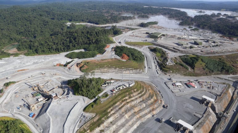 Aerial view of a copper mine cut into the rainforest