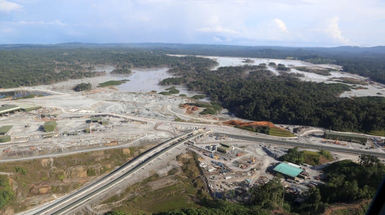 Aerial view of a copper mine cut into the rainforest