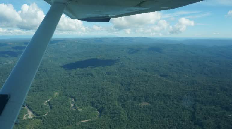 The officially recognized territory of the Sápara is one and a half times the area of Greater London. Aerial view of the Sapara rainforest from a small plane