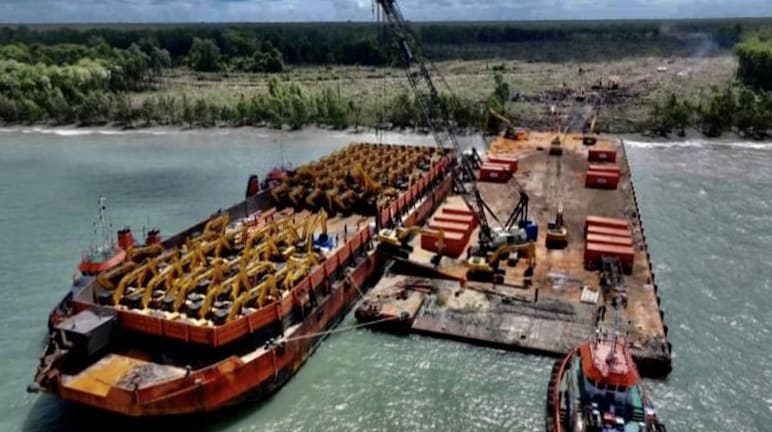 Barge full of excavators