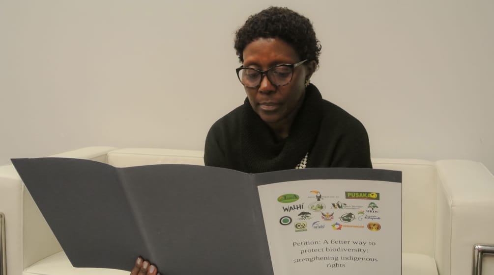 The Executive Secretary of the Convention on Biological Diversity, Elizabeth Maruma Mrema Elizabeth Maruma Mrema reading indigenous rights petition