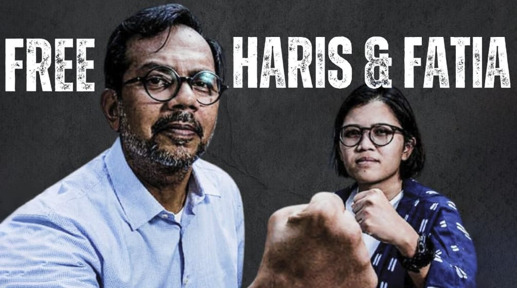 Haris Azhar and Fatia Maulidiyanti before a black background