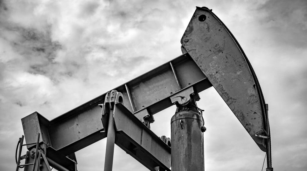 Oil pumpjack with a cloudy sky in the background