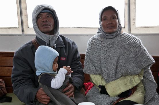 A family with child: Bidin, Ida and son Agung