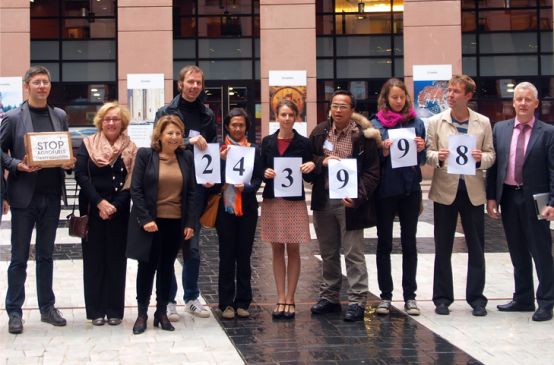 Environmental activists hand over the signatures to members of the European Parliament