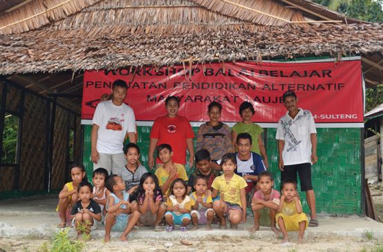 Students sit in front of their learning center