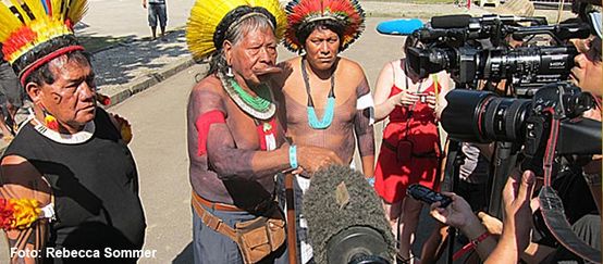 Chief Raoni with his feathered headdress and war paint gives an Interview