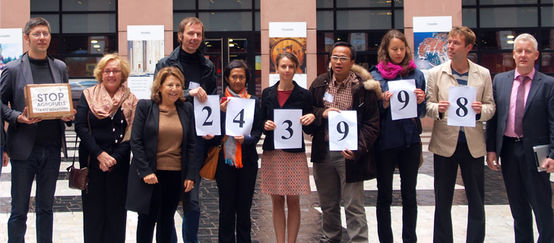 Environmental activists hand over the signatures to members of the European Parliament
