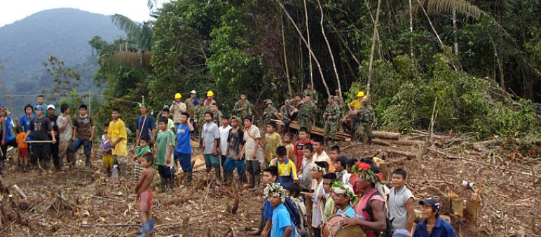 A community of the indigenous tribe embera standing in a clearing