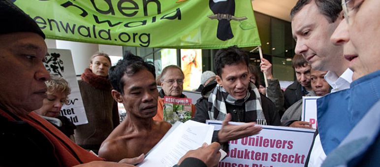 Protest in front of Unilever on December 14th 2011 Protesters with a banner from Rainforest Rescue in front of Unilever